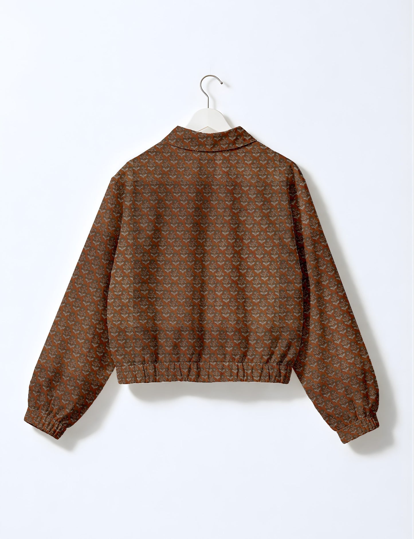 Upcycled Bomber Jacket made from recycled sari materials, featuring a cute cropped shape, elasticated hem and cuffs, and contrast sari print lining. Sustainable apparel promoting eco-friendly fashion and ethical clothing.