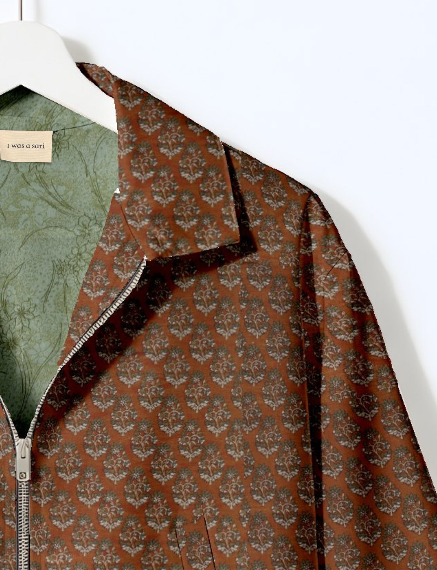 Upcycled Bomber Jacket made from recycled sari materials, featuring a cute cropped shape, elasticated hem and cuffs, and contrast sari print lining. Sustainable apparel promoting eco-friendly fashion and ethical clothing.