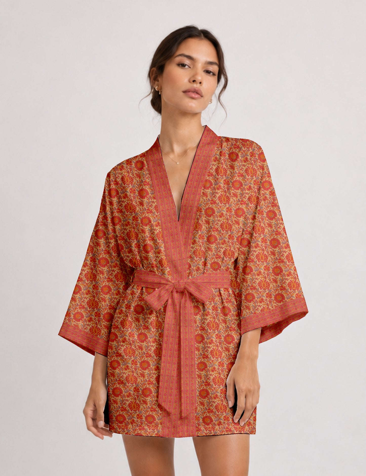 Short kimono robe with wrap front, V-neckline, wide sleeves, waist tie, and concealed skort detail.