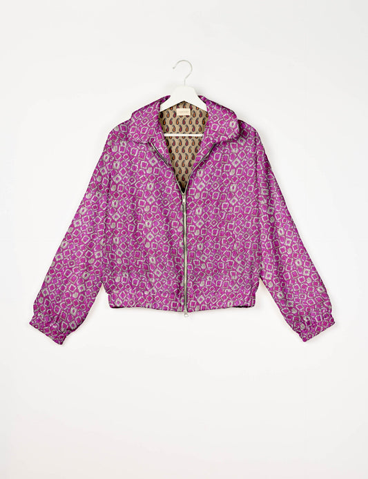 Upcycled Bomber Jacket made from recycled sari materials, featuring a cute cropped shape, elasticated hem and cuffs, and contrast sari print lining. Sustainable apparel promoting eco-friendly fashion and ethical clothing.