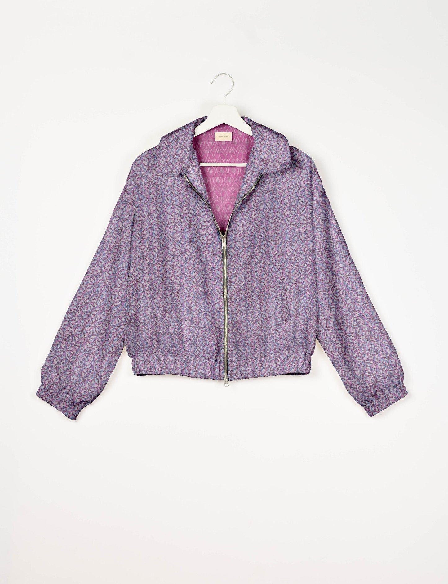 Upcycled Bomber Jacket made from recycled sari materials, featuring a cute cropped shape, elasticated hem and cuffs, and contrast sari print lining. Sustainable apparel promoting eco-friendly fashion and ethical clothing.