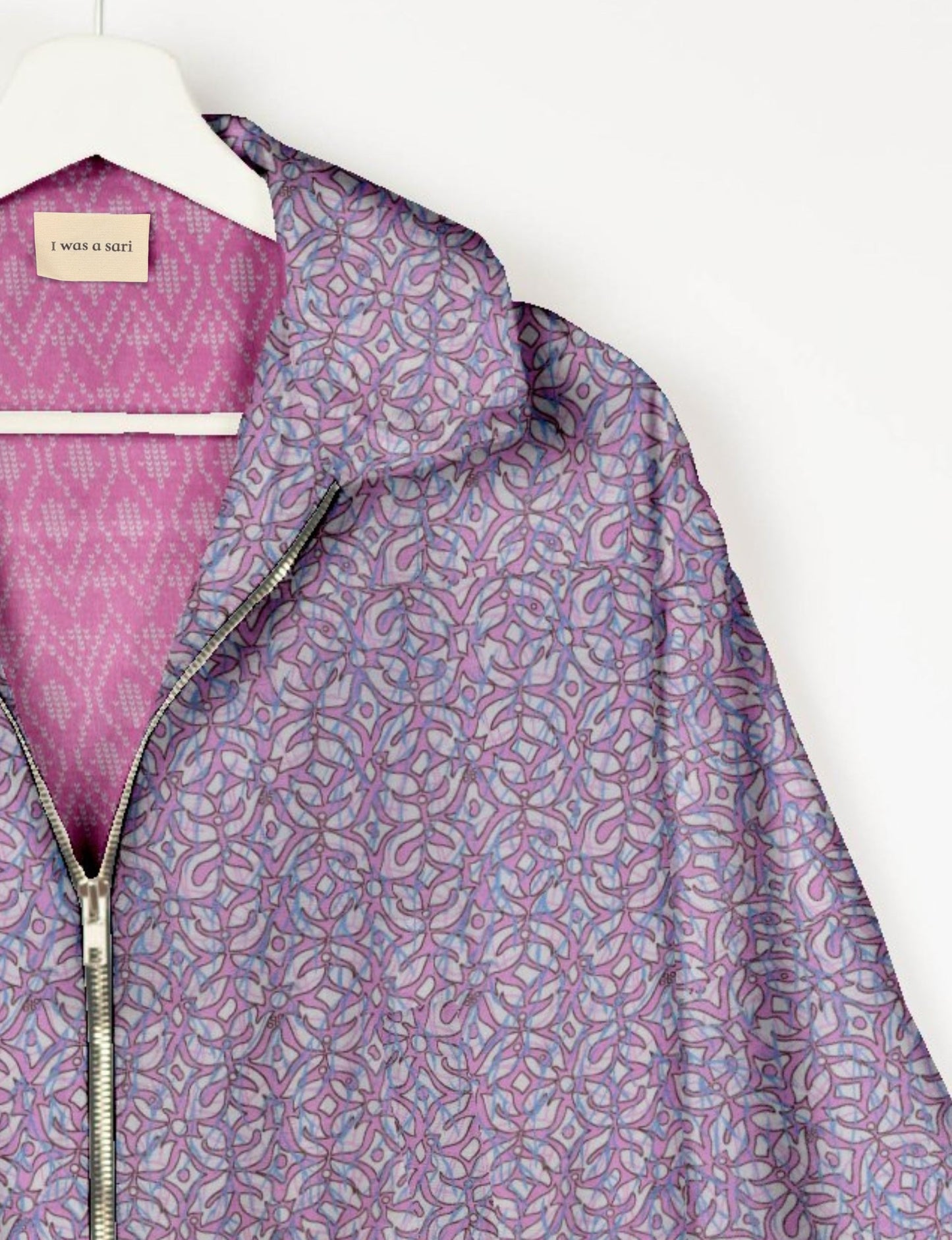 Upcycled Bomber Jacket made from recycled sari materials, featuring a cute cropped shape, elasticated hem and cuffs, and contrast sari print lining. Sustainable apparel promoting eco-friendly fashion and ethical clothing.