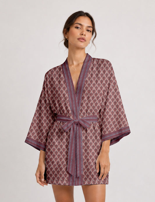 Short kimono robe with wrap front, V-neckline, wide sleeves, waist tie, and concealed skort detail.
