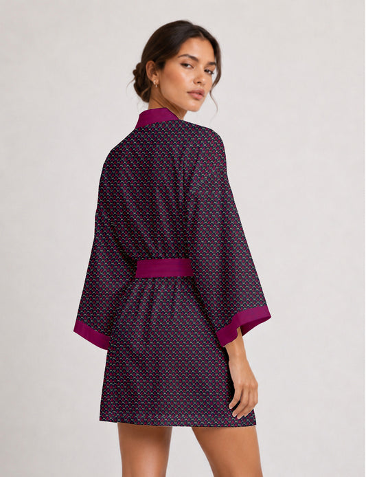 Short kimono robe with wrap front, V-neckline, wide sleeves, waist tie, and concealed skort detail.