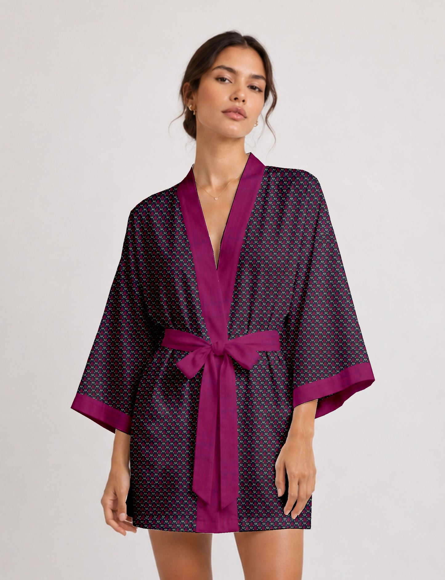 Short kimono robe with wrap front, V-neckline, wide sleeves, waist tie, and concealed skort detail.