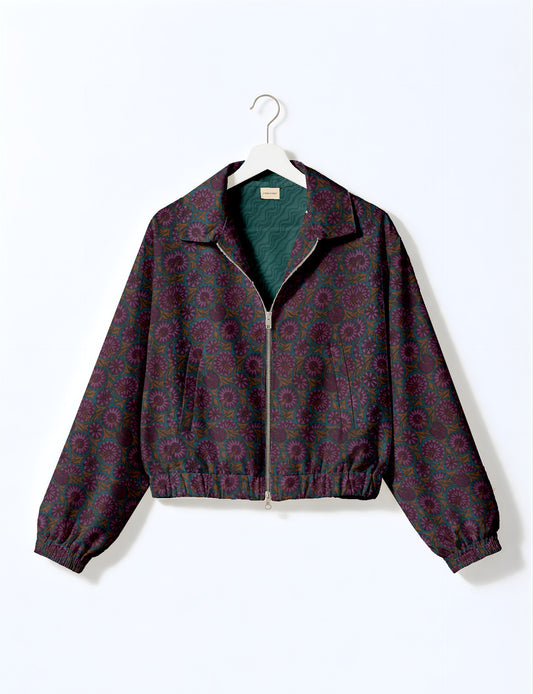 Upcycled Bomber Jacket made from recycled sari materials, featuring a cute cropped shape, elasticated hem and cuffs, and contrast sari print lining. Sustainable apparel promoting eco-friendly fashion and ethical clothing.