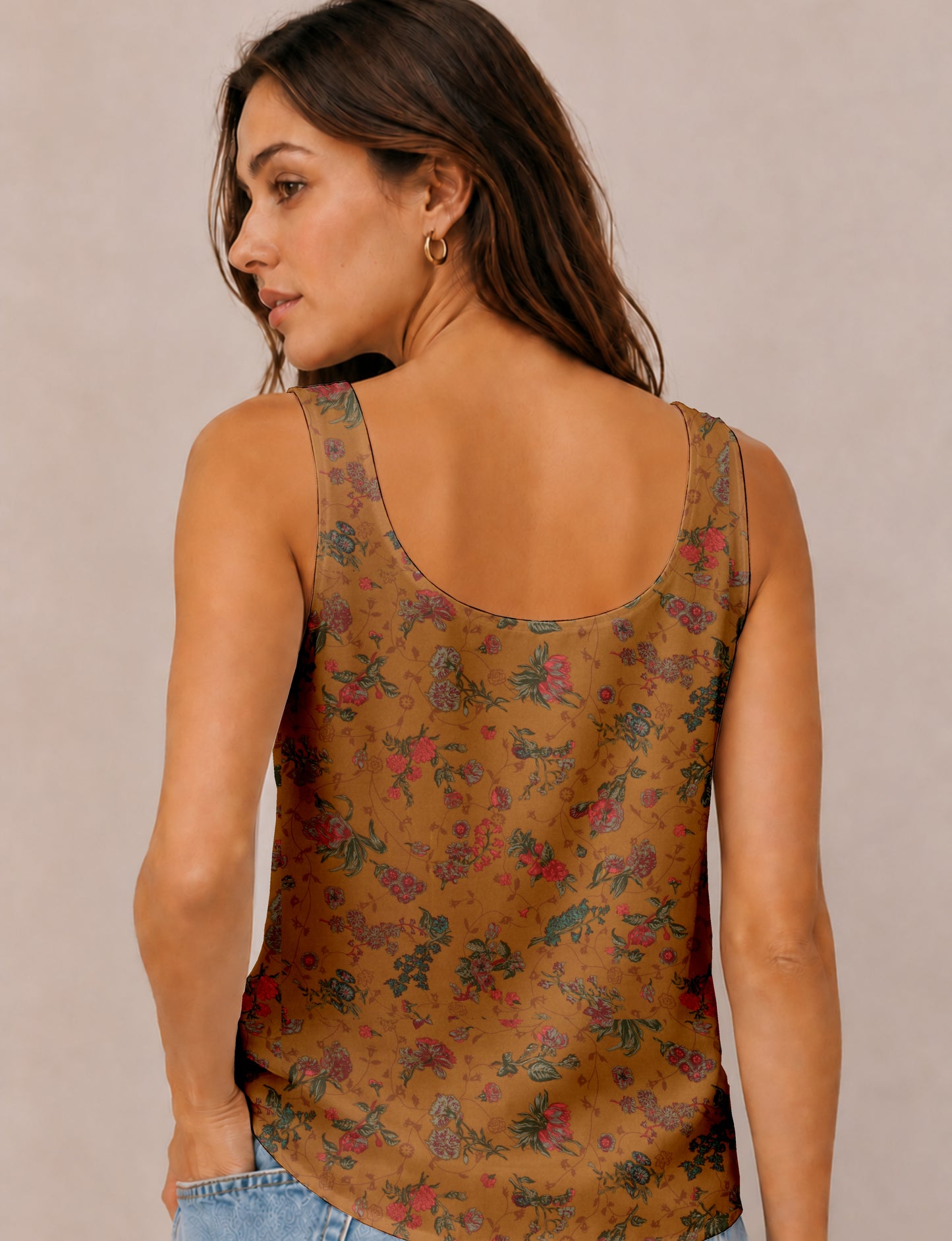 Women's sleeveless blouse with a relaxed straight fit, wide scoop neckline, deep scoop back, and hip-length silhouette.
