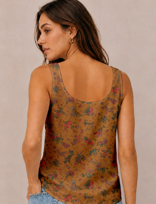 Women's sleeveless blouse with a relaxed straight fit, wide scoop neckline, deep scoop back, and hip-length silhouette.