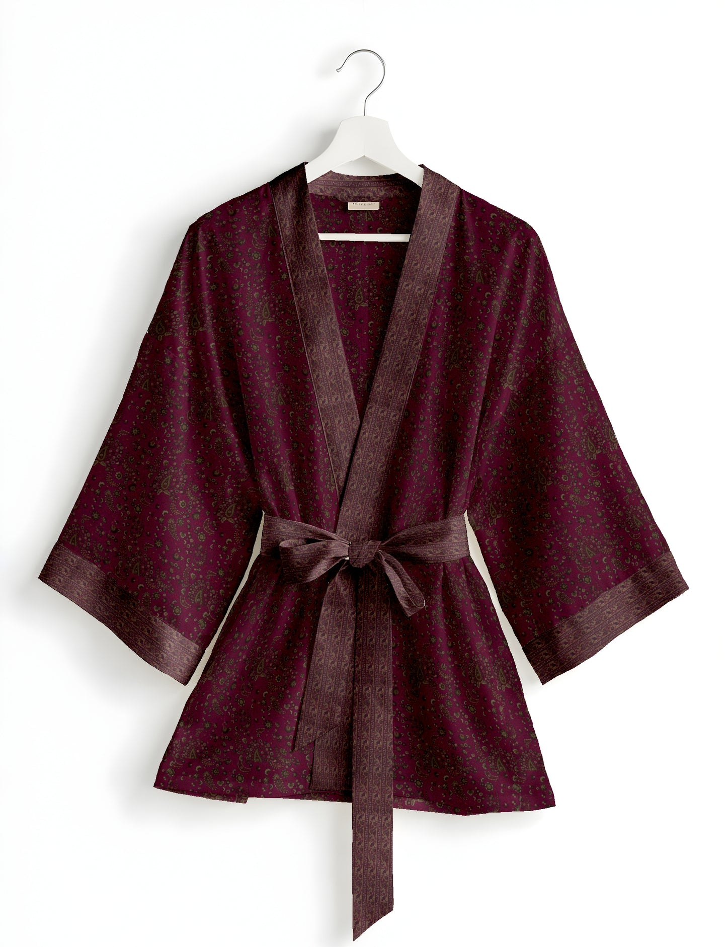 Short kimono robe with wrap front, V-neckline, wide sleeves, waist tie, and concealed skort detail.