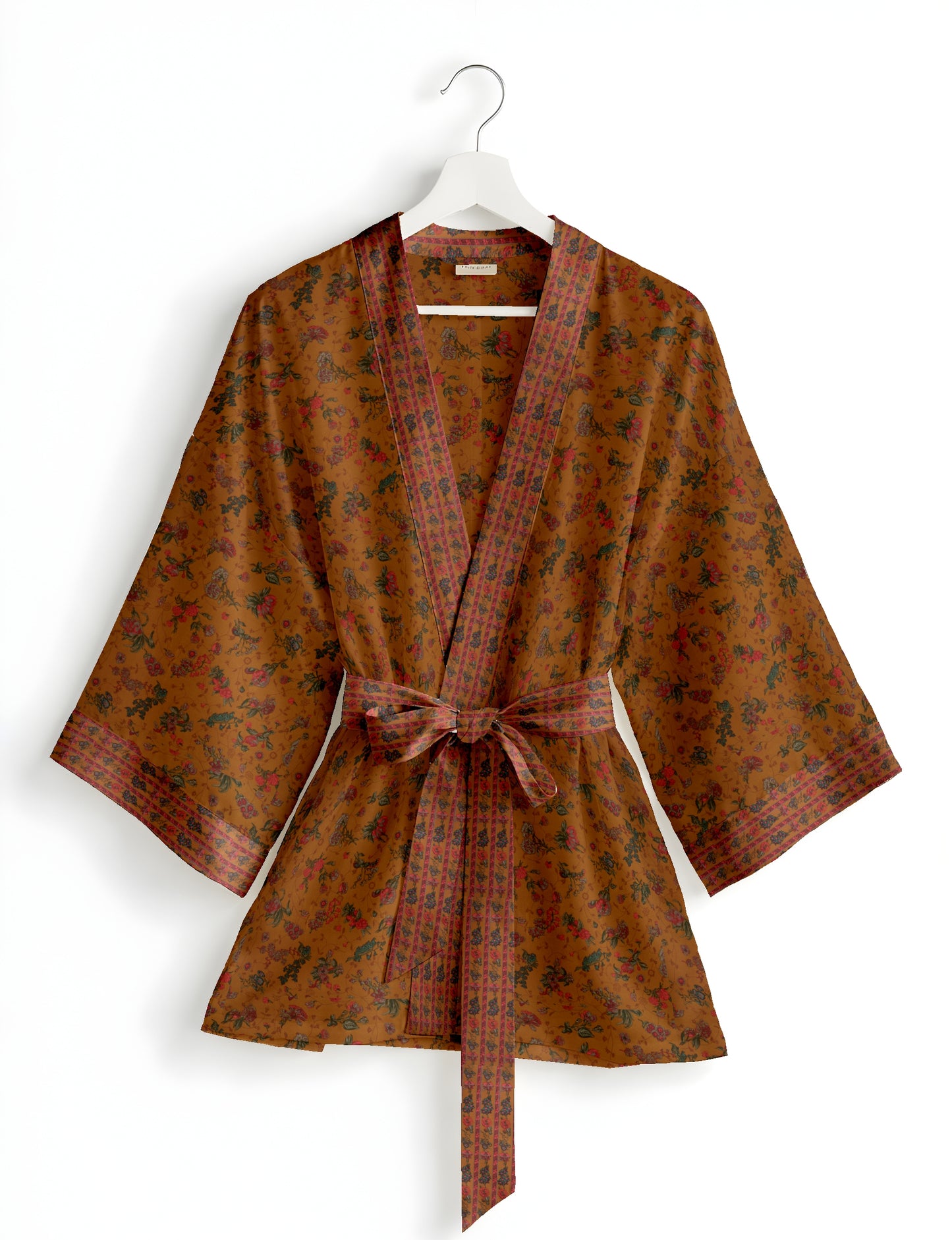 Short kimono robe with wrap front, V-neckline, wide sleeves, waist tie, and concealed skort detail.