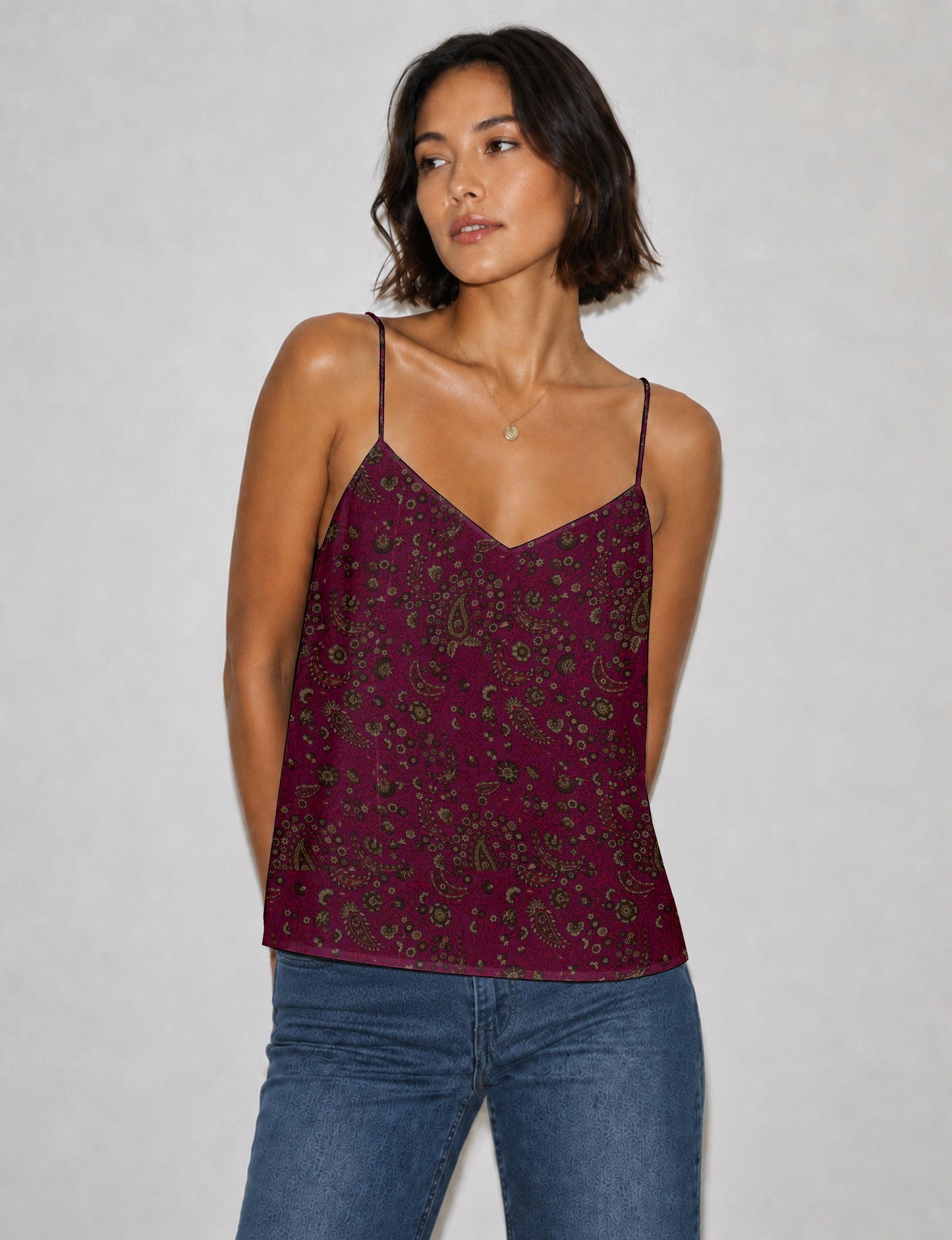 Women's sleeveless slip top with a relaxed straight fit, soft V-neckline, deep V-back, and delicate spaghetti straps.