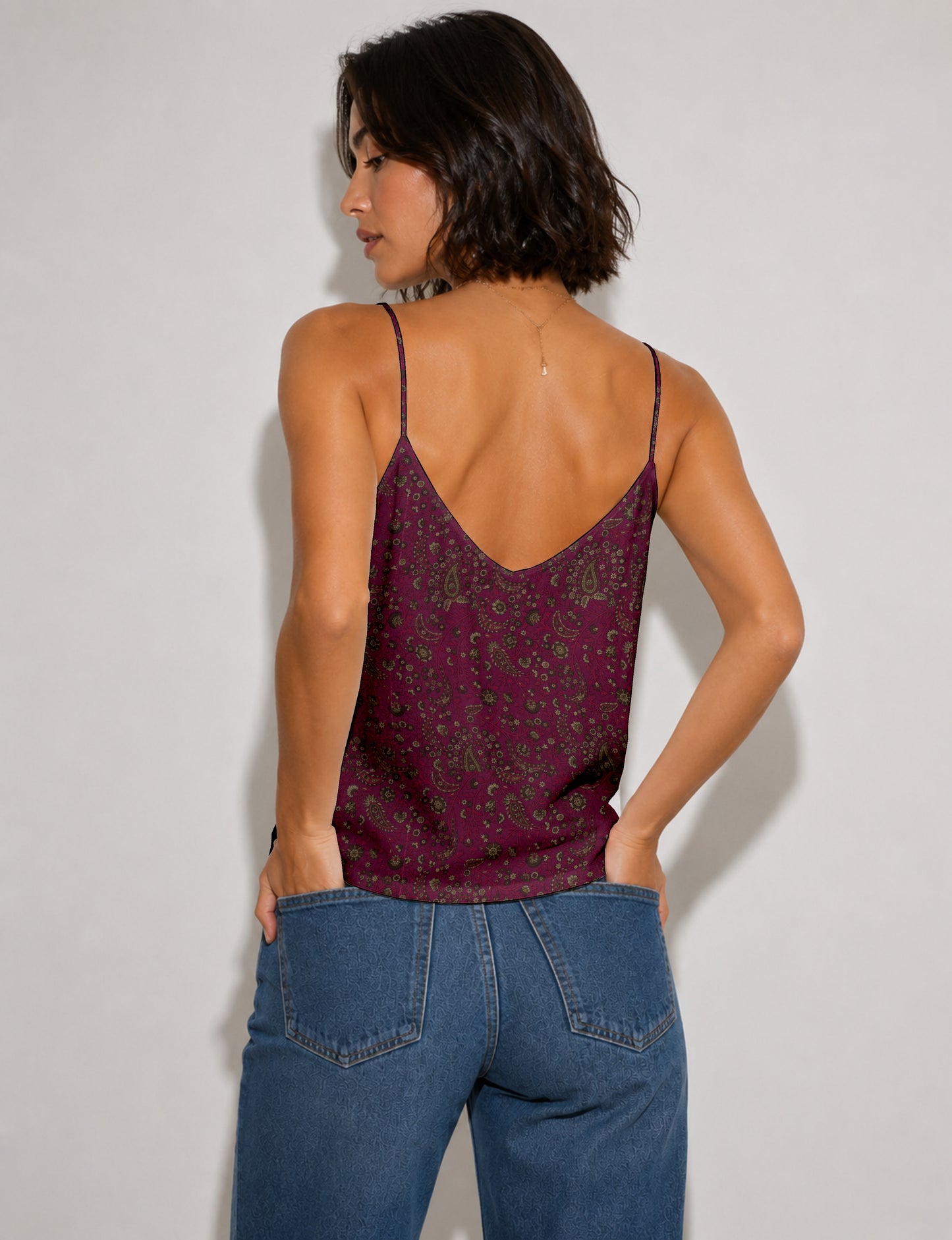 Women's sleeveless slip top with a relaxed straight fit, soft V-neckline, deep V-back, and delicate spaghetti straps.