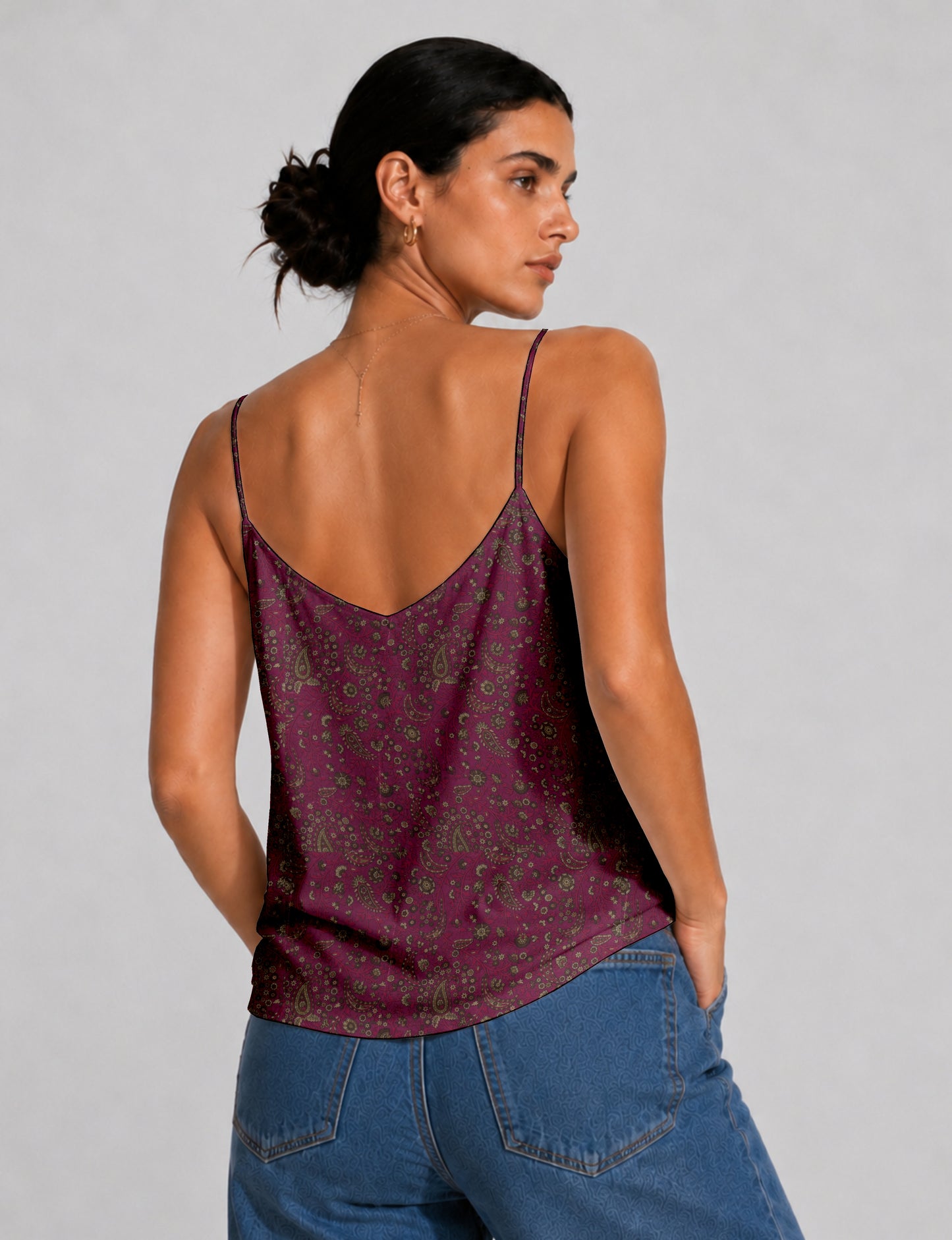 Women's sleeveless slip top with a relaxed straight fit, soft V-neckline, deep V-back, and delicate spaghetti straps.