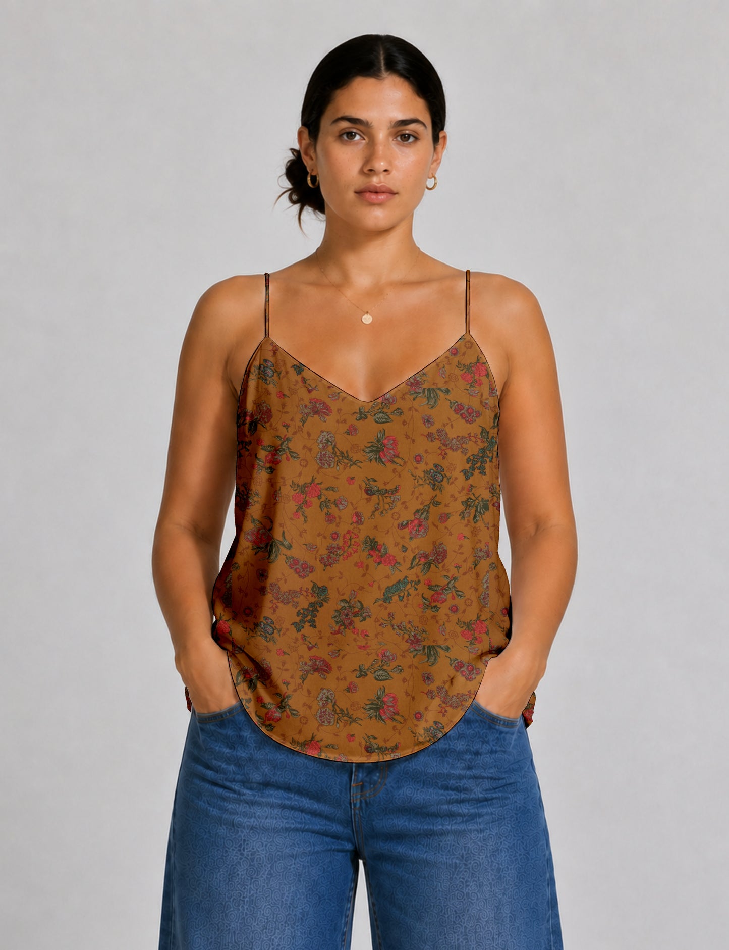 Women's sleeveless slip top with a relaxed straight fit, soft V-neckline, deep V-back, and delicate spaghetti straps.