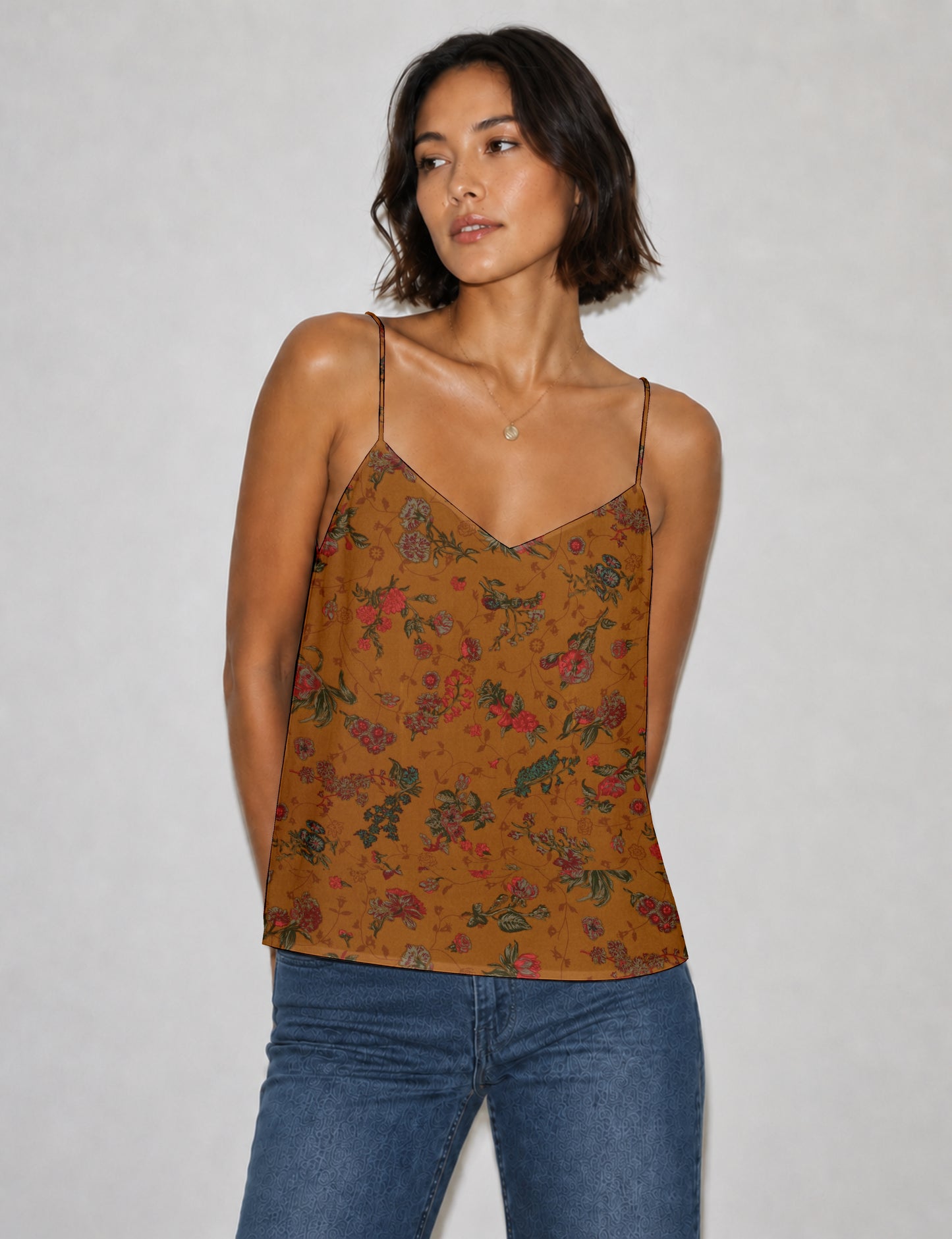 Women's sleeveless slip top with a relaxed straight fit, soft V-neckline, deep V-back, and delicate spaghetti straps.