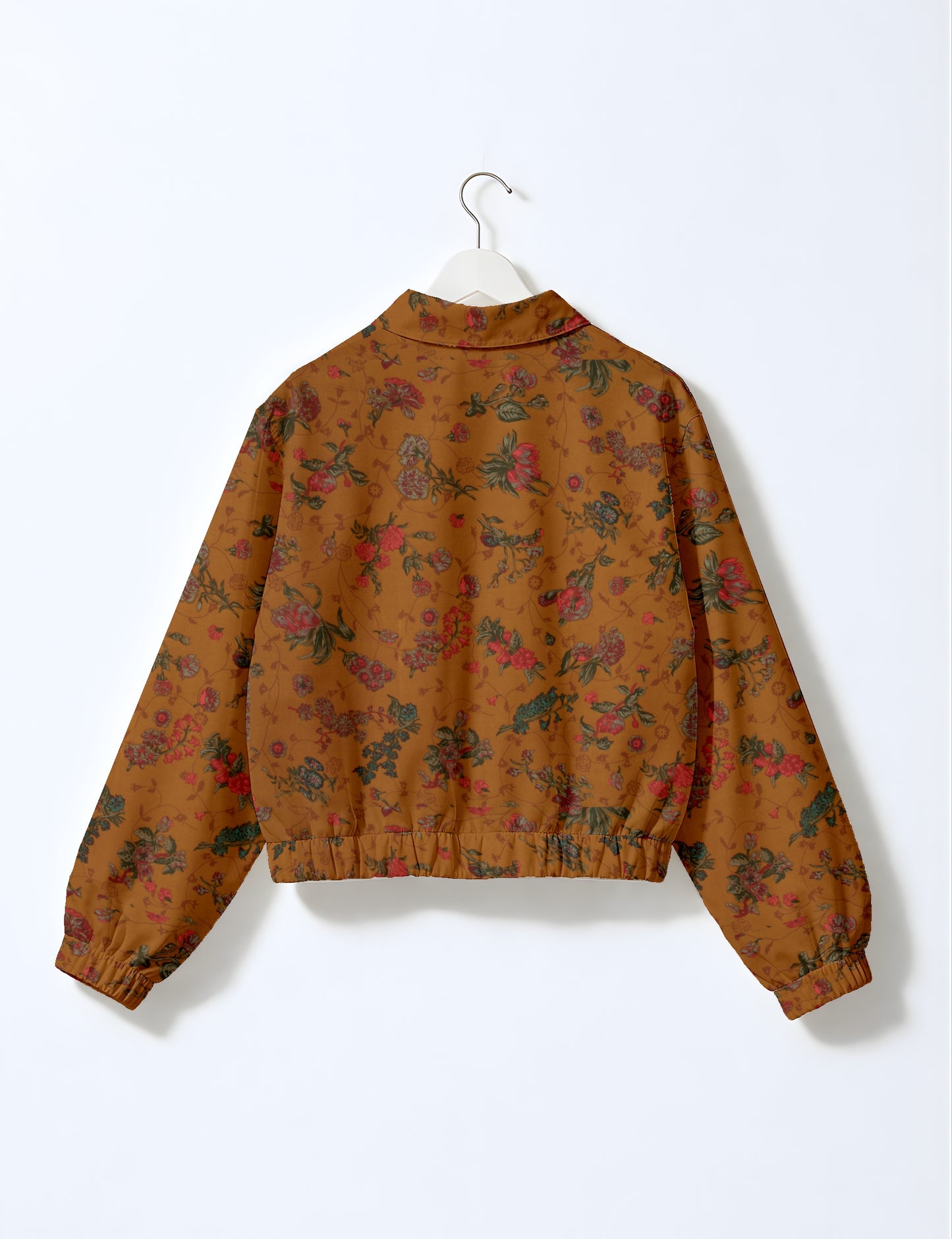 Yellow bomber jacket with micro diamond and floral pattern, elastic cuffs and waistband, shown from back on hanger