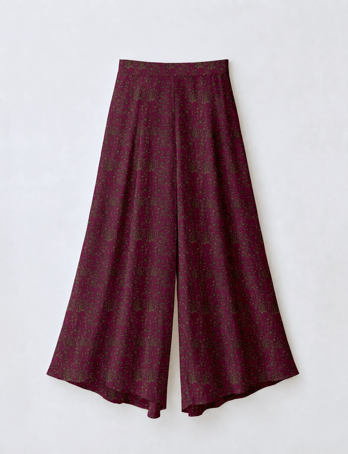 Blue wide leg palazzo trousers with a small tropical floral pattern, flat lay front view