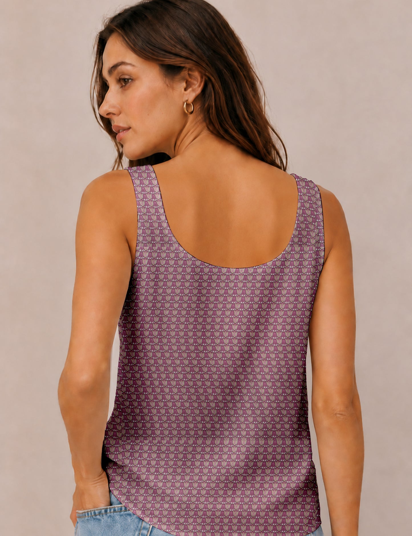 Women's sleeveless blouse with a relaxed straight fit, wide scoop neckline, deep scoop back, and hip-length silhouette.