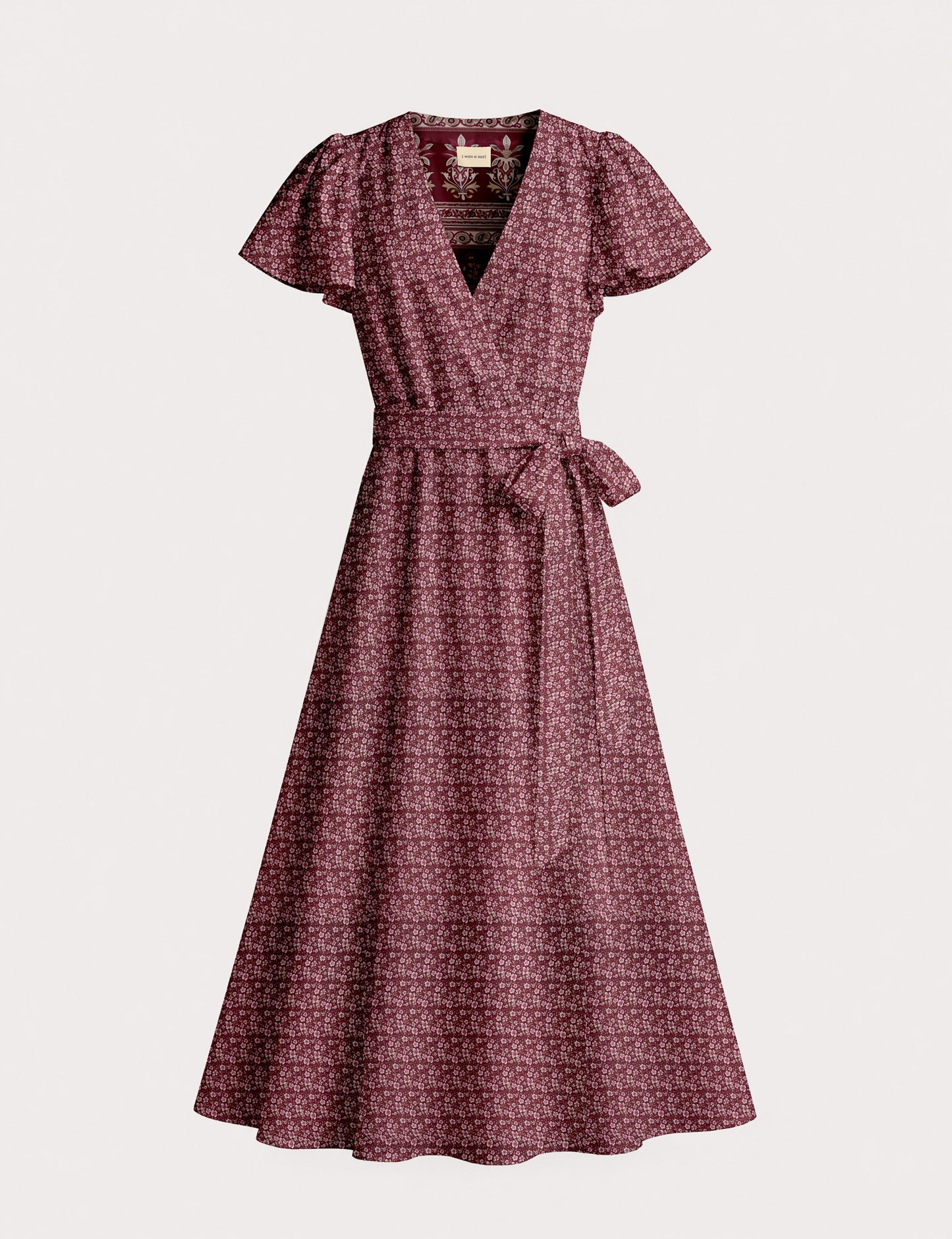 Elegant midi wrap dress with a V-neckline, adjustable waist tie, fitted bodice, and flared skirt for a timeless, flattering silhouette.