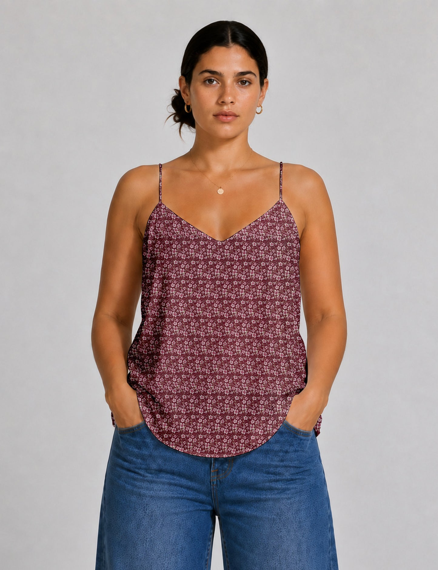 Women's sleeveless slip top with a relaxed straight fit, soft V-neckline, deep V-back, and delicate spaghetti straps.