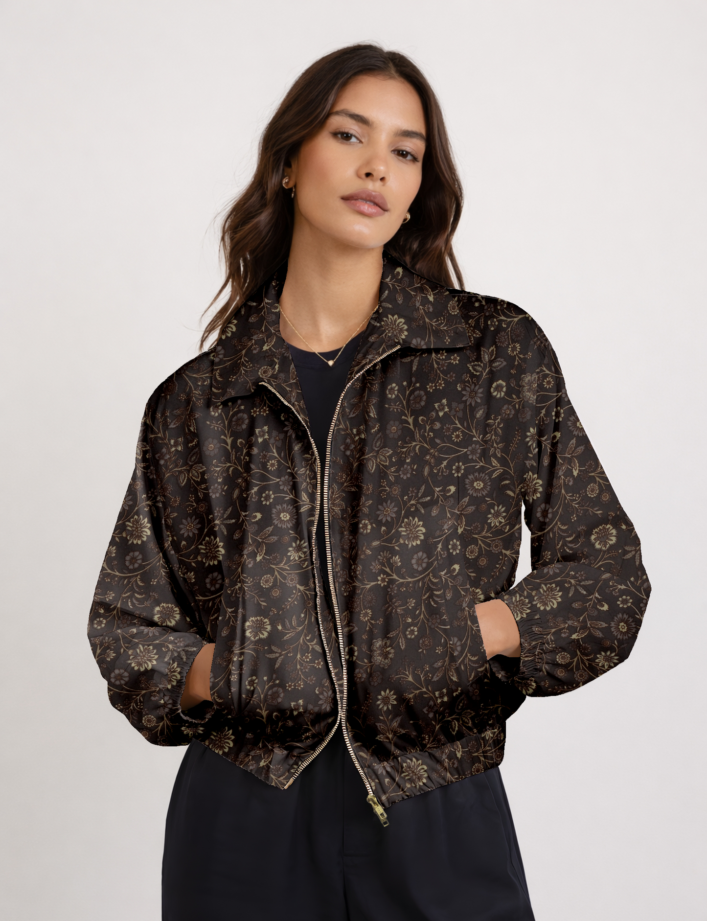 Women's cropped bomber jacket with twin metallic front zippers, welt pockets, elasticated hem and cuffs, and contrast sari print lining.