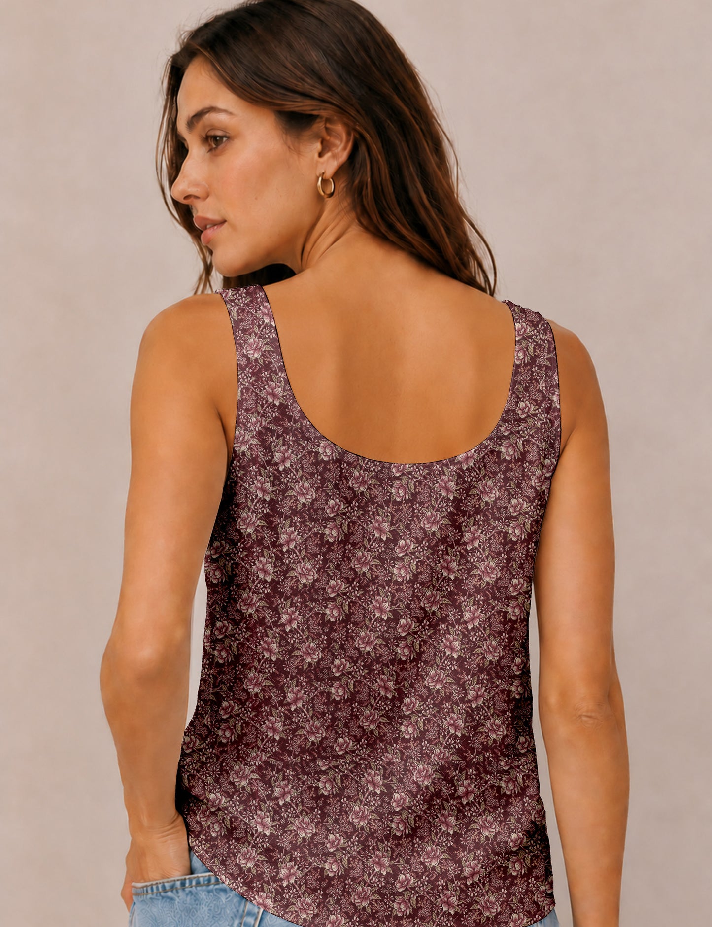 Women's sleeveless blouse with a relaxed straight fit, wide scoop neckline, deep scoop back, and hip-length silhouette.