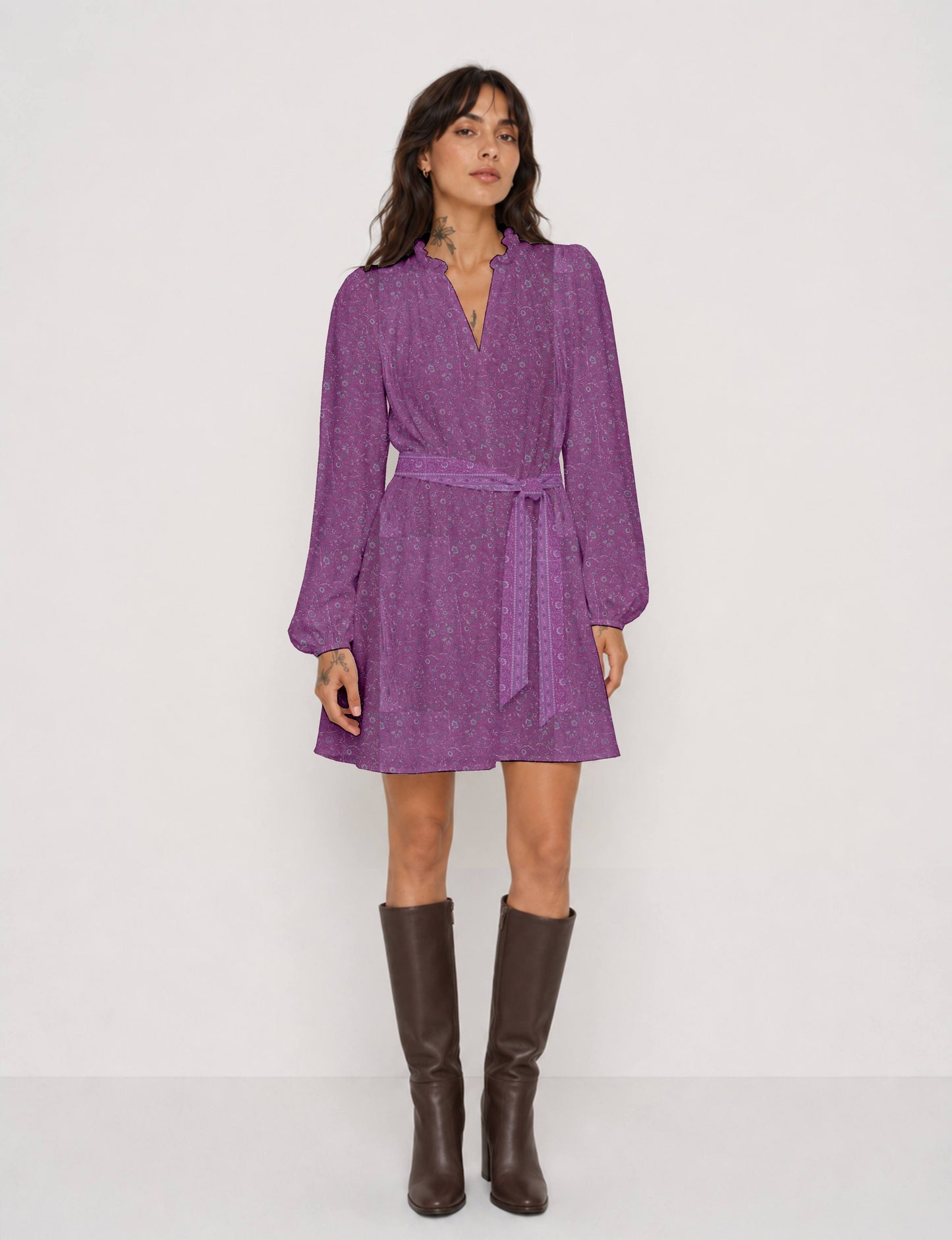 Swing dress with detachable tie belt, gathered ruffle neckline, full-length voluminous sleeves, elastic cuffs, and relaxed A-line silhouette in an above-knee length.