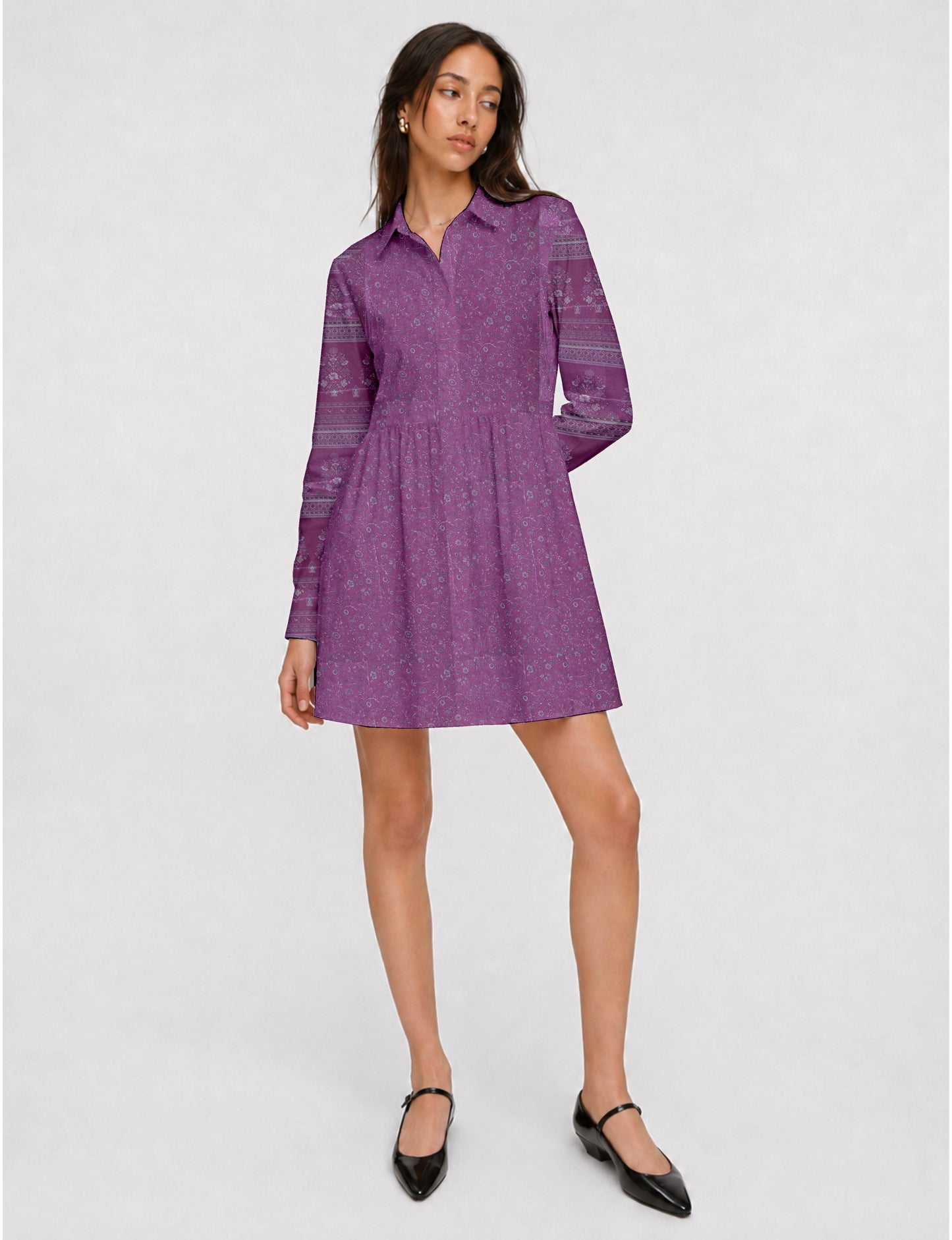 Short shirt dress with a relaxed A-line silhouette, point collar, partial button placket, gathered waist, side pockets, and full-length cuffed sleeves.