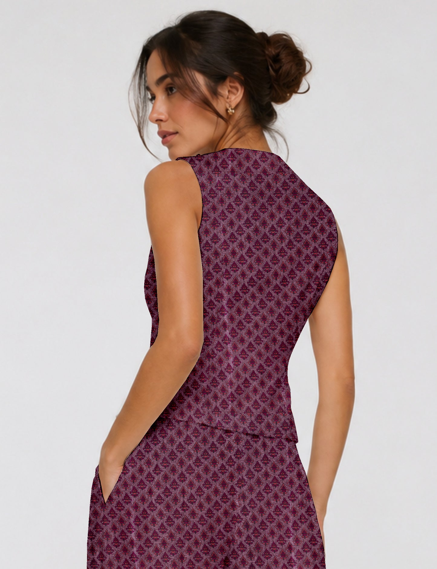 Women's fitted waistcoat with V-neck, single-breasted button closure, tailored silhouette, and pointed hem in sustainable fashion.