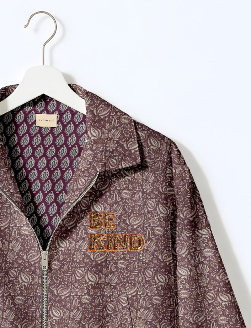 BE KIND Bomber jacket made from upcycled sari fabric with handcrafted Aari embroidery by female artisans.