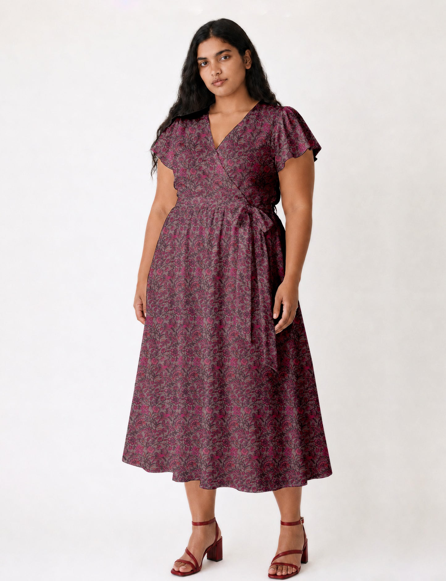 Elegant midi wrap dress with a V-neckline, adjustable waist tie, fitted bodice, and flared skirt for a timeless, flattering silhouette.