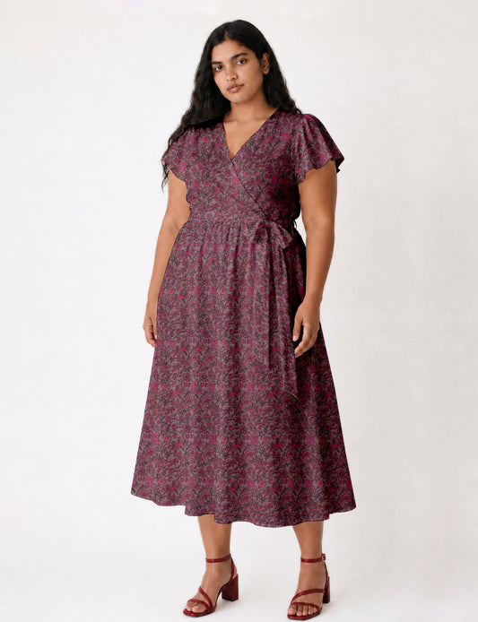 Elegant midi wrap dress with a V-neckline, adjustable waist tie, fitted bodice, and flared skirt for a timeless, flattering silhouette.