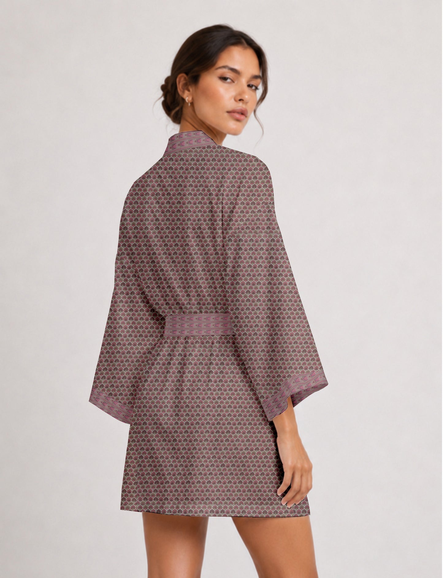 Short kimono robe with wrap front, V-neckline, wide sleeves, waist tie, and concealed skort detail.