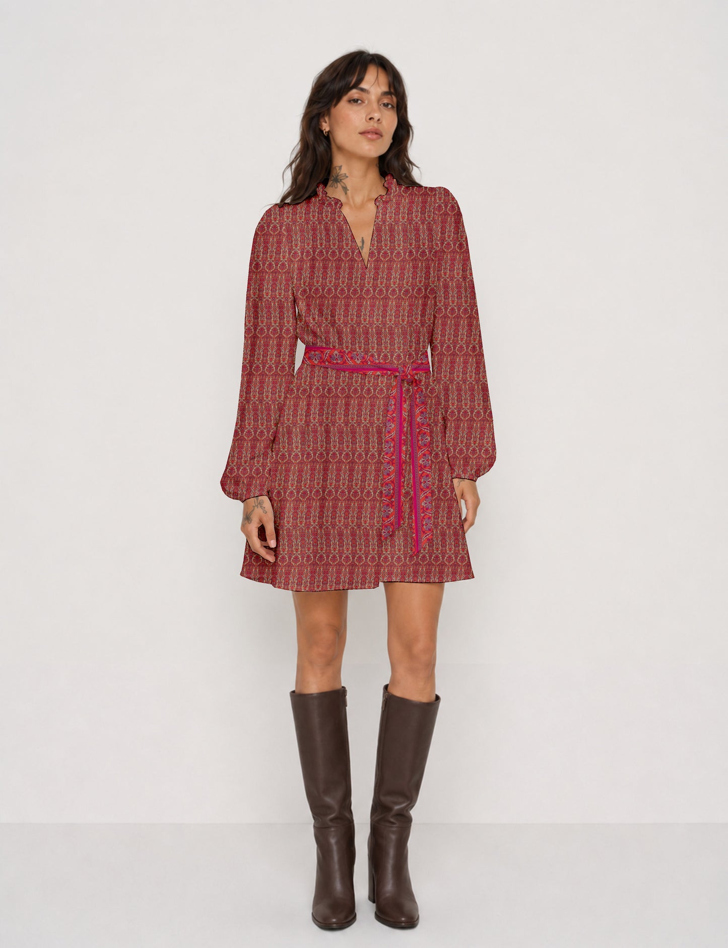 Swing dress with detachable tie belt, gathered ruffle neckline, full-length voluminous sleeves, elastic cuffs, and relaxed A-line silhouette in an above-knee length.