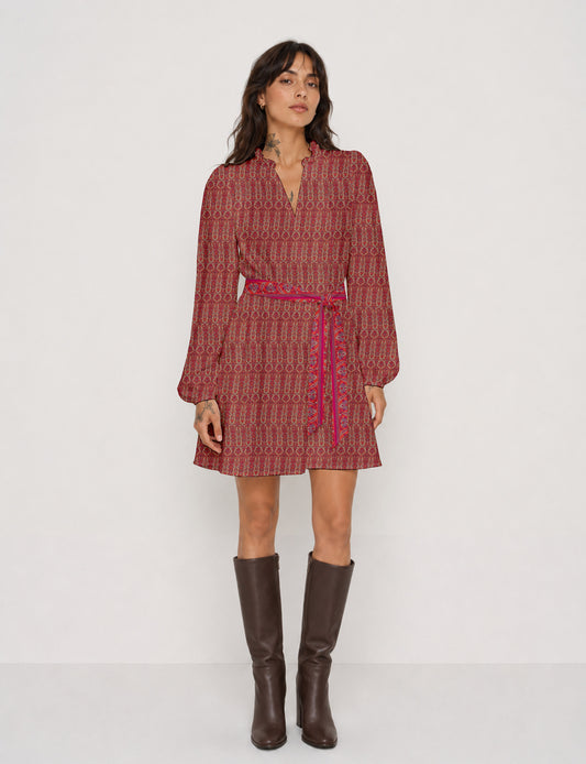 Swing dress with detachable tie belt, gathered ruffle neckline, full-length voluminous sleeves, elastic cuffs, and relaxed A-line silhouette in an above-knee length.