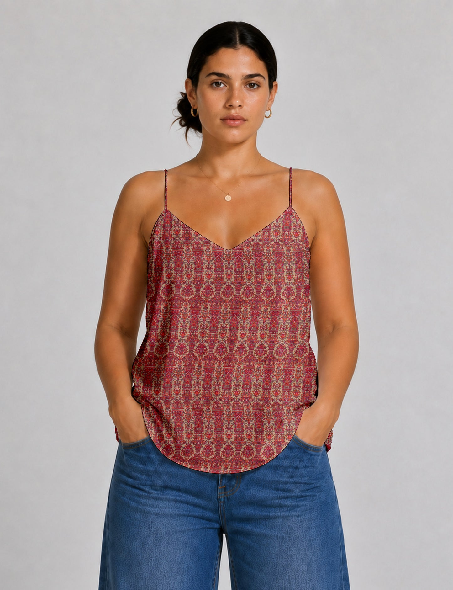 Women's sleeveless slip top with a relaxed straight fit, soft V-neckline, deep V-back, and delicate spaghetti straps.