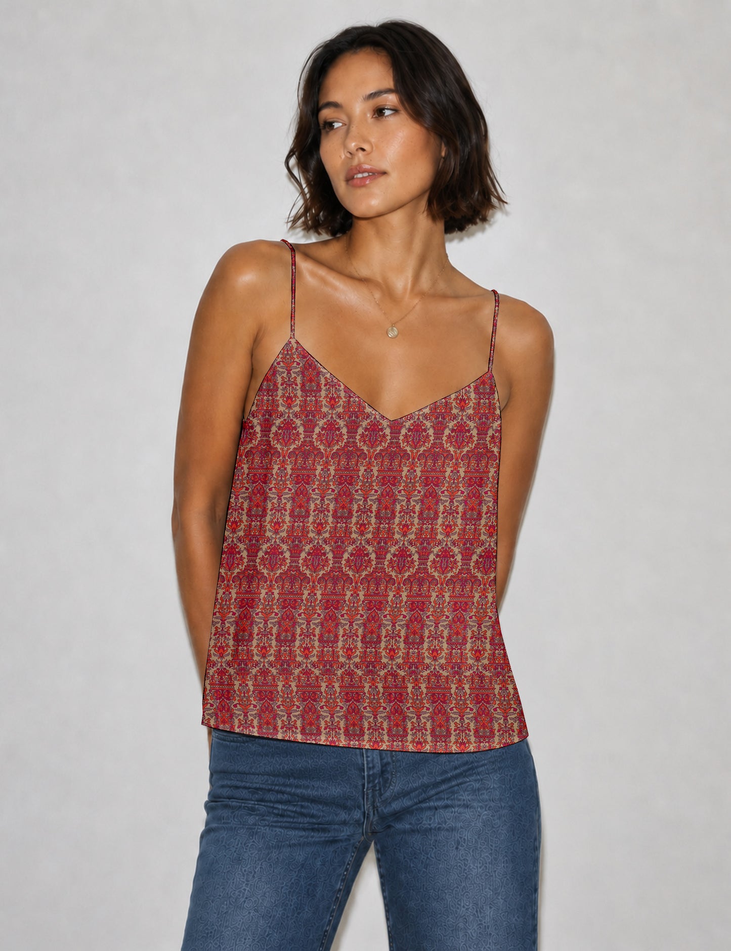 Women's sleeveless slip top with a relaxed straight fit, soft V-neckline, deep V-back, and delicate spaghetti straps.