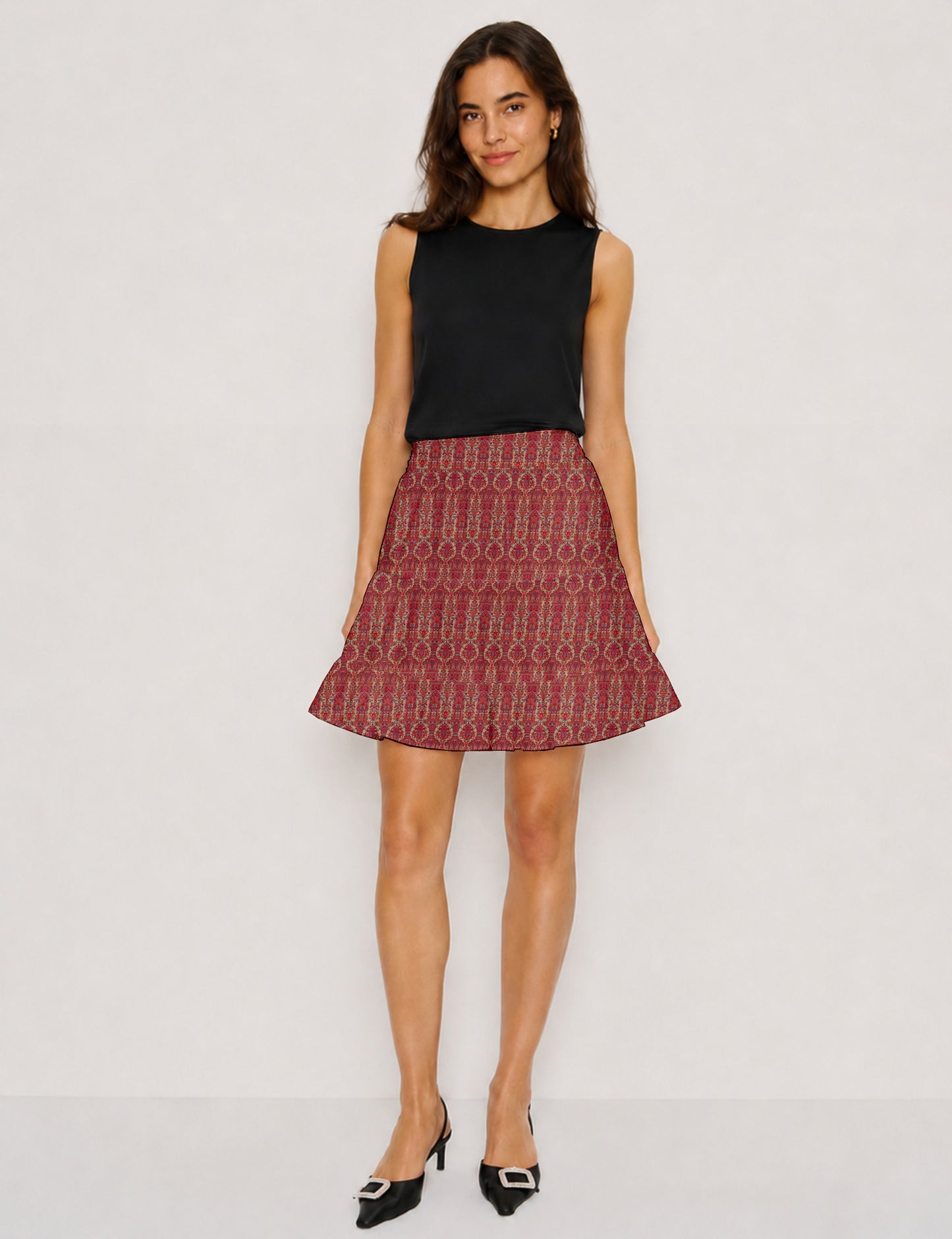 Short tiered skirt with a fitted waistband, knife pleats, softly flared silhouette, side seam pockets, and above-the-knee length.