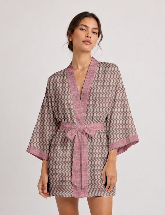 Short kimono robe with wrap front, V-neckline, wide sleeves, waist tie, and concealed skort detail.