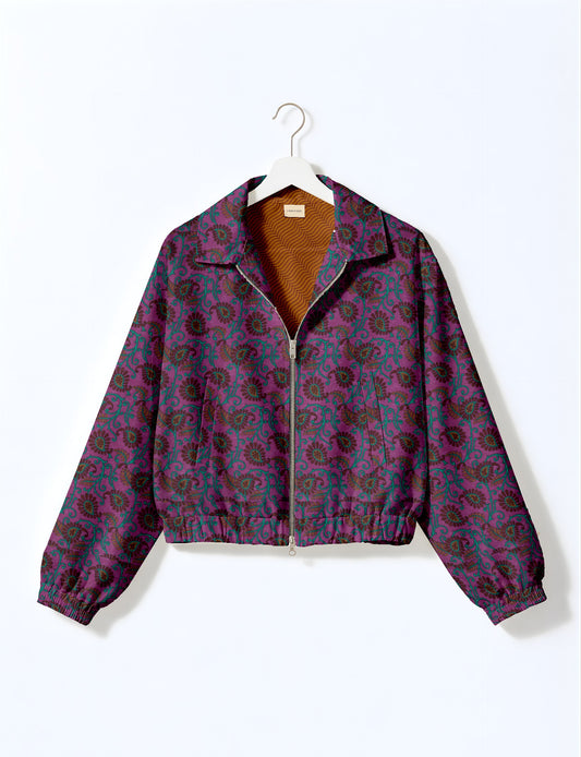 Upcycled Bomber Jacket made from recycled sari materials, featuring a cute cropped shape, elasticated hem and cuffs, and contrast sari print lining. Sustainable apparel promoting eco-friendly fashion and ethical clothing.
