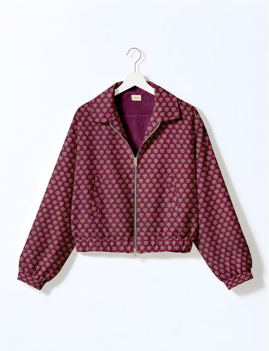 Upcycled Bomber Jacket made from recycled sari materials, featuring a cute cropped shape, elasticated hem and cuffs, and contrast sari print lining. Sustainable apparel promoting eco-friendly fashion and ethical clothing.