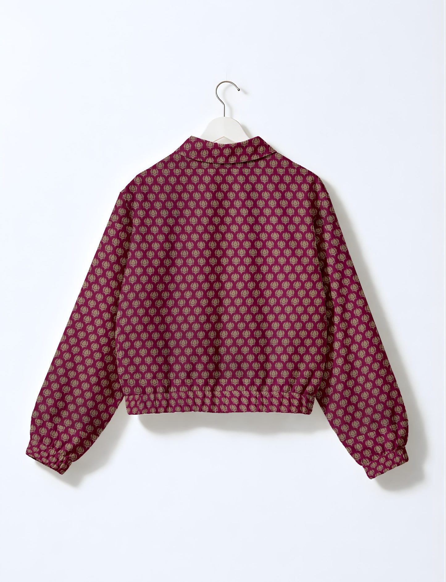 Upcycled Bomber Jacket made from recycled sari materials, featuring a cute cropped shape, elasticated hem and cuffs, and contrast sari print lining. Sustainable apparel promoting eco-friendly fashion and ethical clothing.
