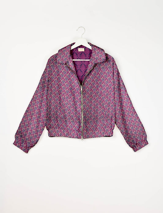 Upcycled Bomber Jacket made from recycled sari materials, featuring a cute cropped shape, elasticated hem and cuffs, and contrast sari print lining. Sustainable apparel promoting eco-friendly fashion and ethical clothing.