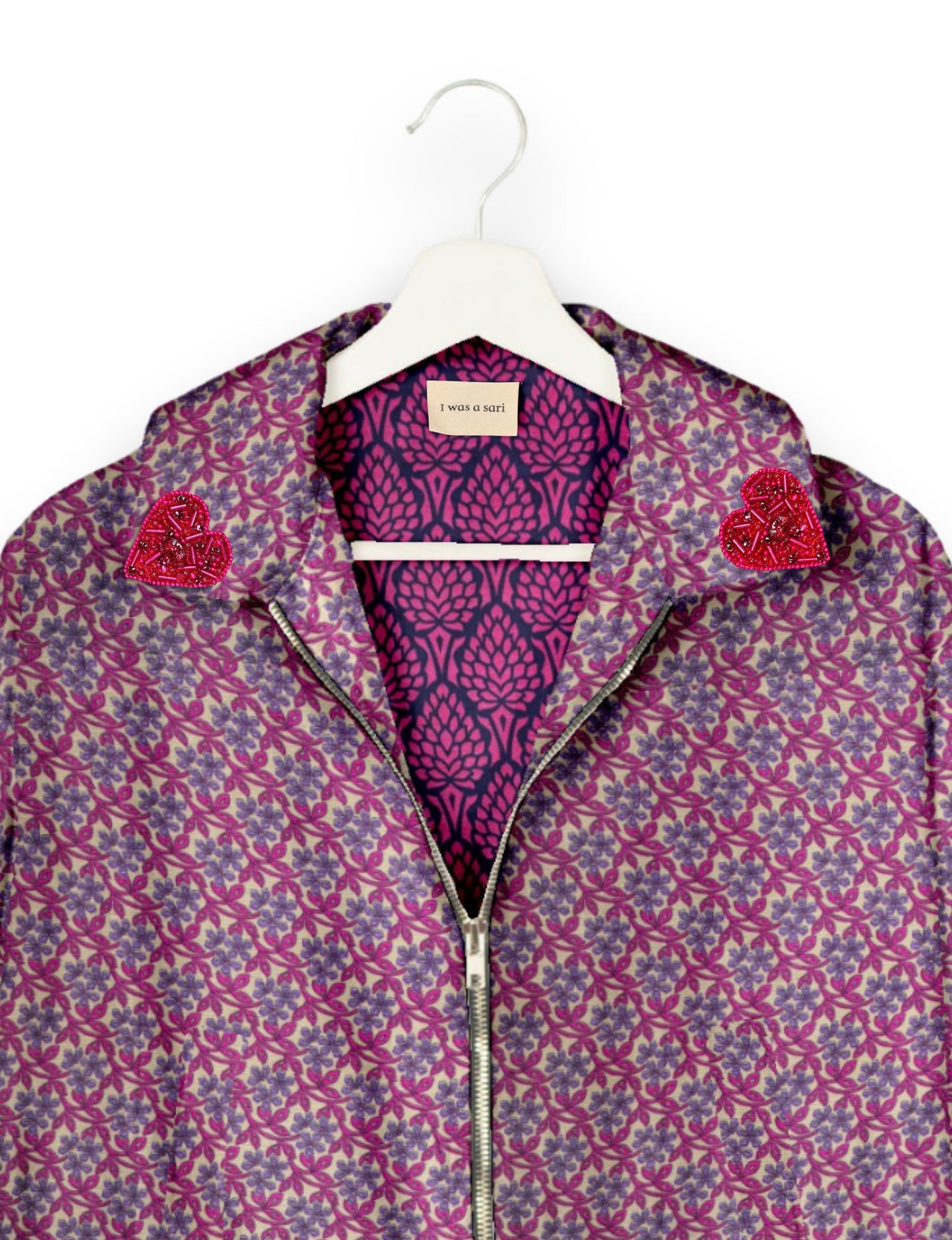 Make a bold statement with our Heart Drop Earrings, a symbol of conscious luxury and ethical fashion. Handcrafted using the intricate Aari embroidery technique, these earrings are made from upcycled sari fabric, embracing slow fashion and zero waste clothing. Elevate your look with sustainable apparel that supports fair trade fashion while reducing textile waste. Choose eco-friendly fashion that speaks of love, artistry, and responsibility.