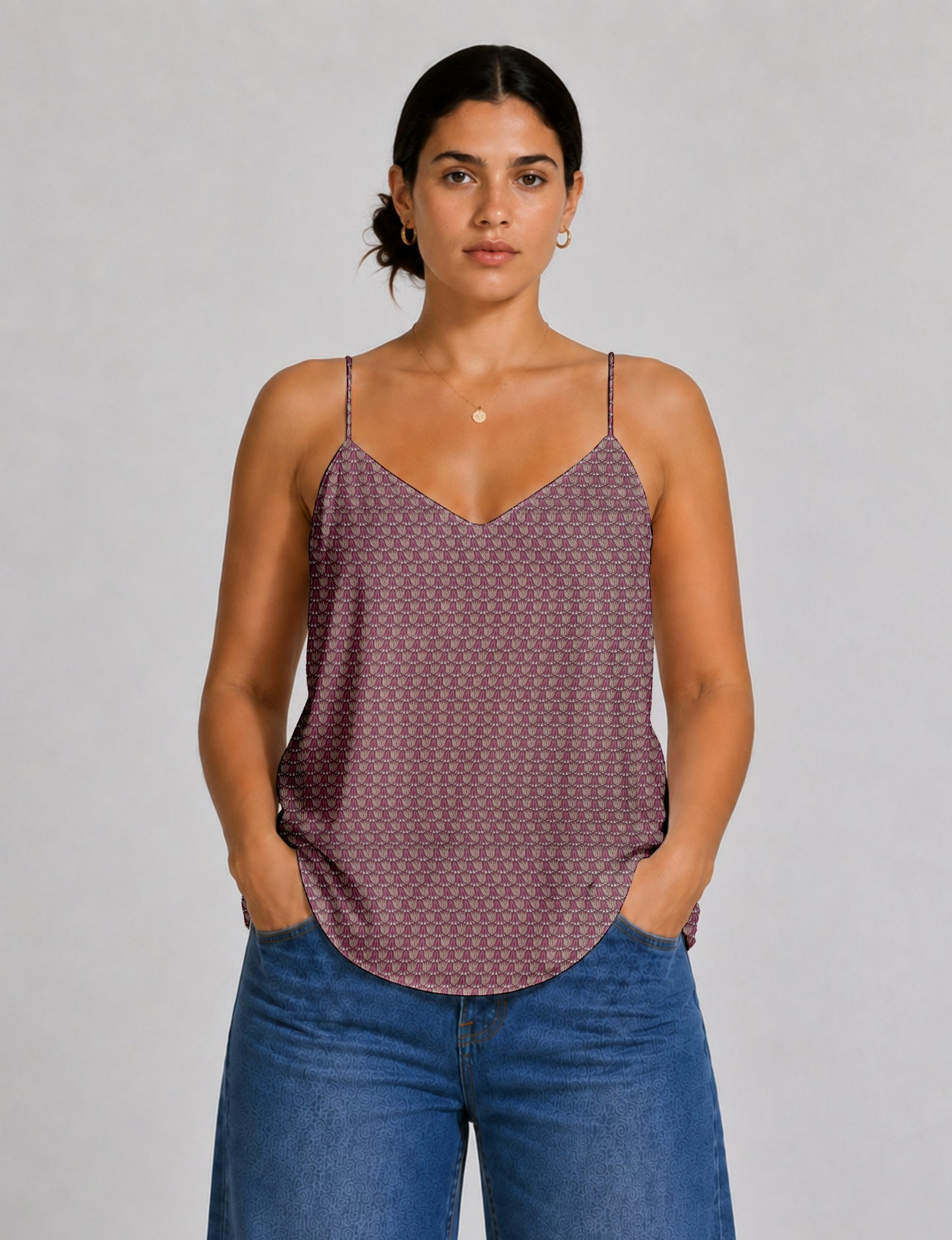 Women's sleeveless slip top with a relaxed straight fit, soft V-neckline, deep V-back, and delicate spaghetti straps.