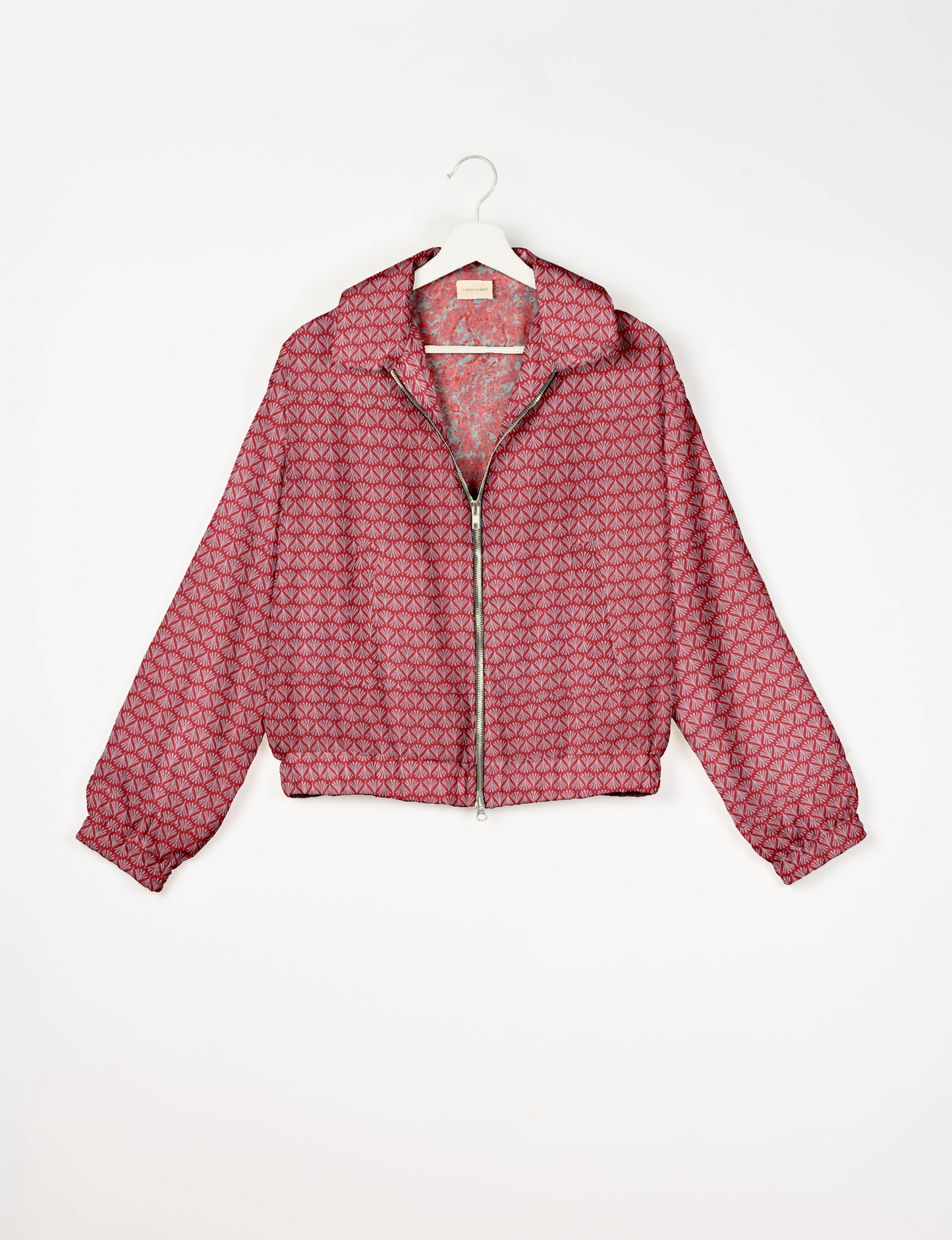 Upcycled Bomber Jacket made from recycled sari materials, featuring a cute cropped shape, elasticated hem and cuffs, and contrast sari print lining. Sustainable apparel promoting eco-friendly fashion and ethical clothing.