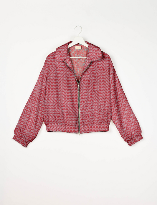 Upcycled Bomber Jacket made from recycled sari materials, featuring a cute cropped shape, elasticated hem and cuffs, and contrast sari print lining. Sustainable apparel promoting eco-friendly fashion and ethical clothing.