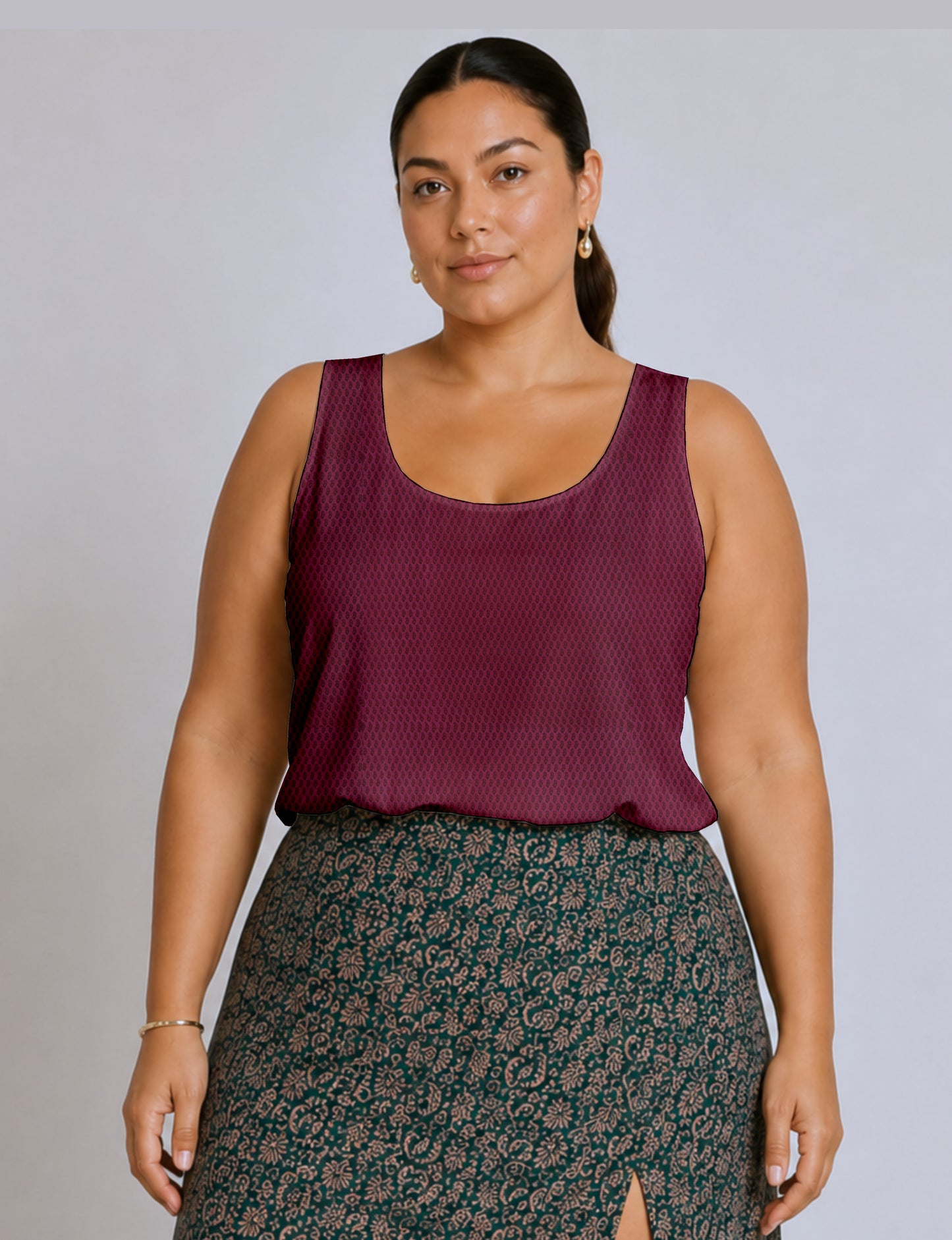 Women's sleeveless blouse with a relaxed straight fit, wide scoop neckline, deep scoop back, and hip-length silhouette.