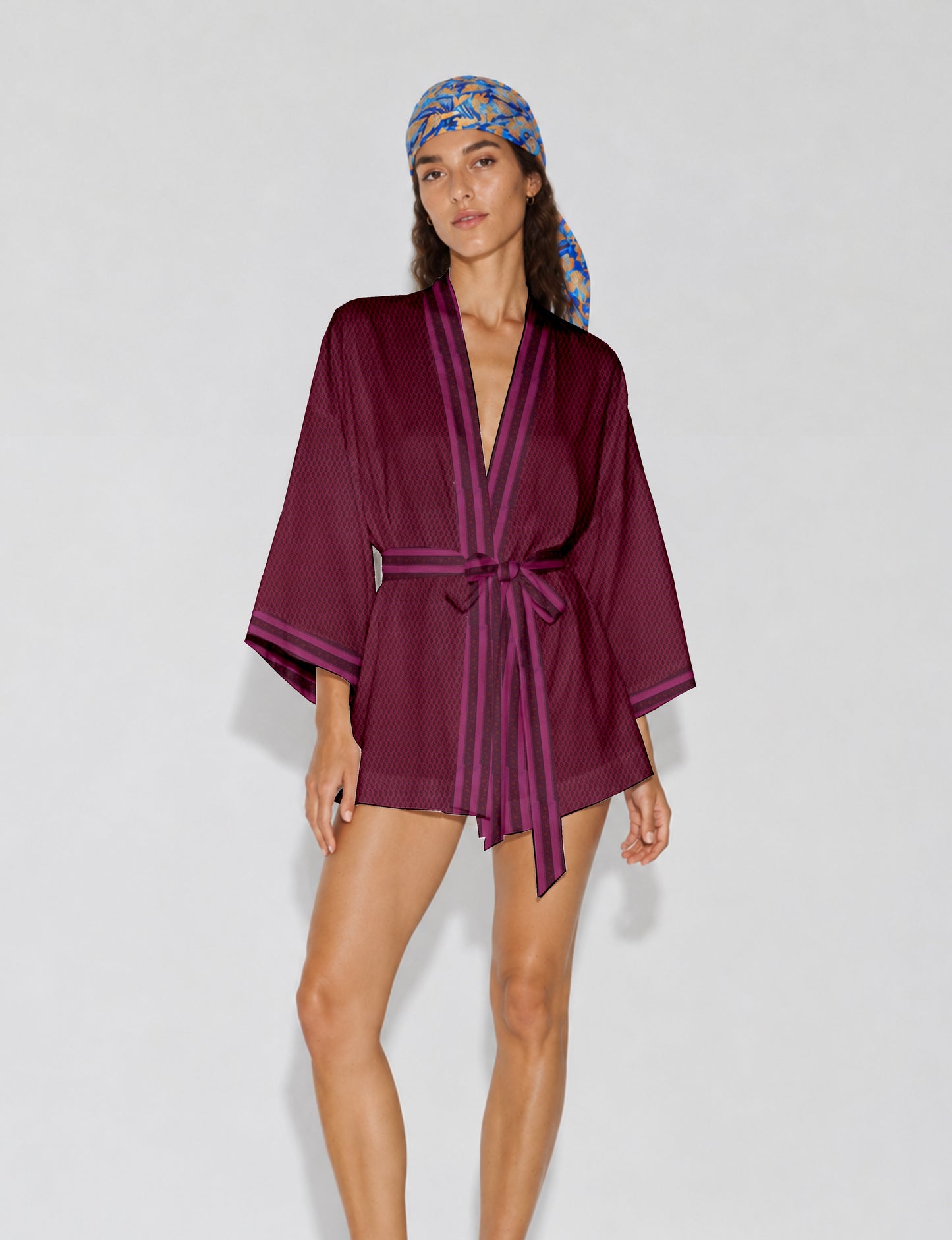 Short kimono robe with wrap front, V-neckline, wide sleeves, waist tie, and concealed skort detail.