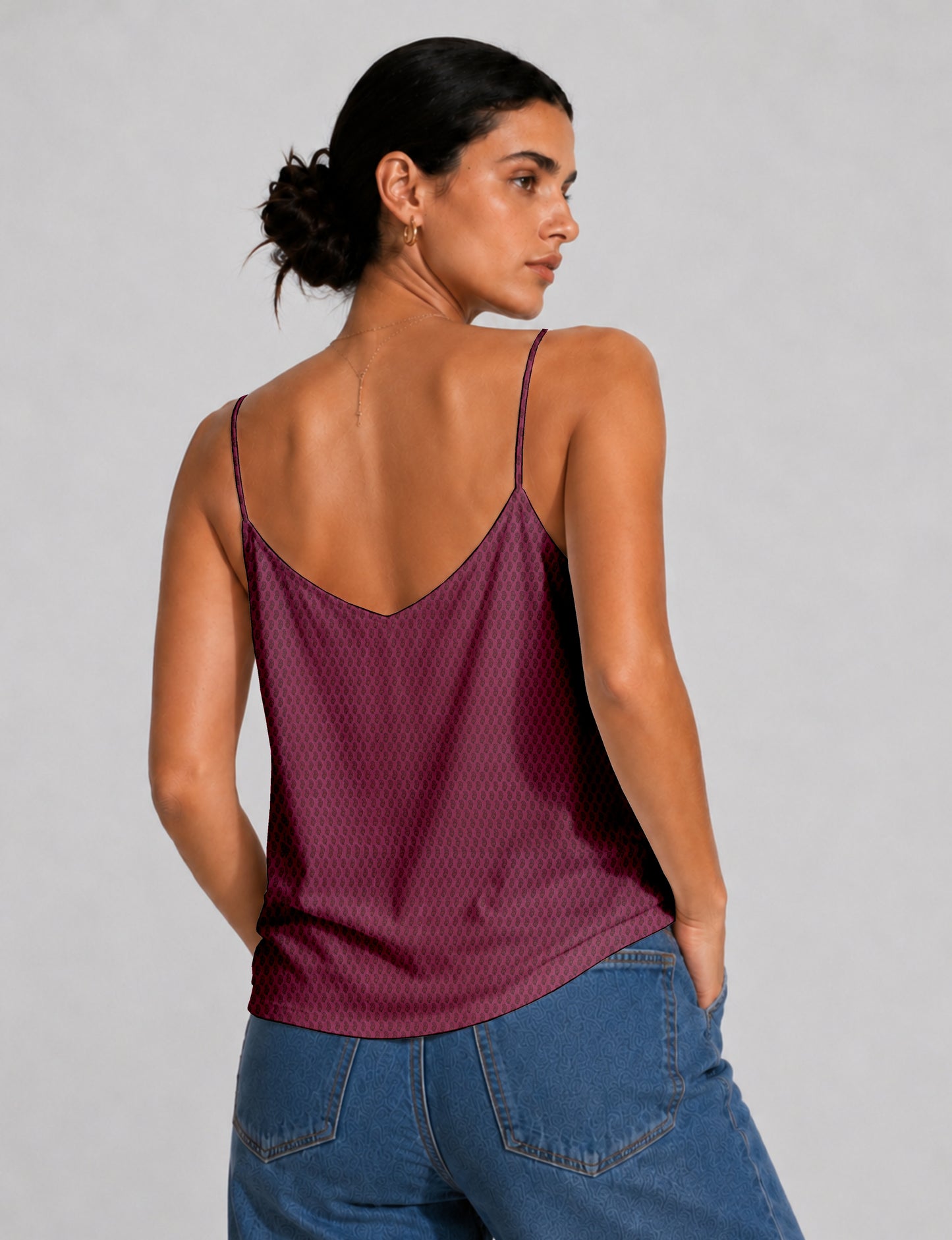 Women's sleeveless slip top with a relaxed straight fit, soft V-neckline, deep V-back, and delicate spaghetti straps.